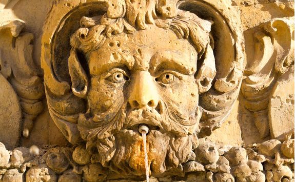 sunlit gargoyle fountain