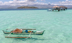 Boat in clear blue water