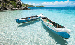 Boats in crystal clear water, Indonesia
