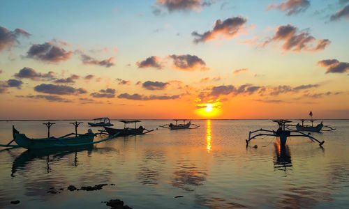 Fishing boats at sunset