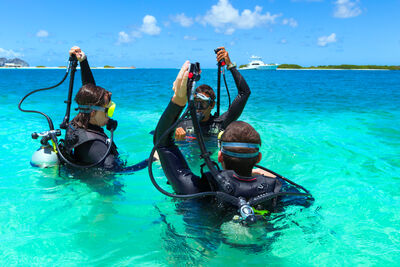Divers entering the water