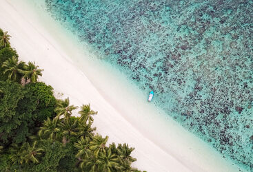 Seychelles Beach Lagoon from above with shore and boat