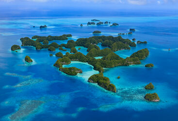 Aerial view of the Palau islands floating among blue waters