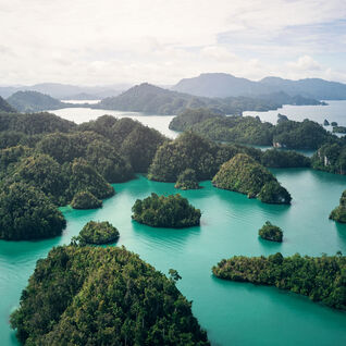 High angle shot of the small lush islands of Indonesia