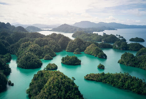 High angle shot of the small lush islands of Indonesia