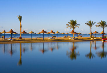 Straw umbrella on the beach. Hurghada, Egypt.