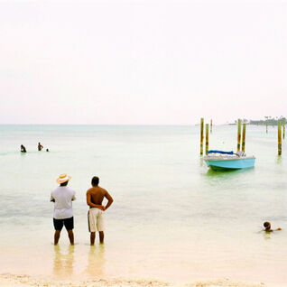 Two men looking out to sea in the Bahamas