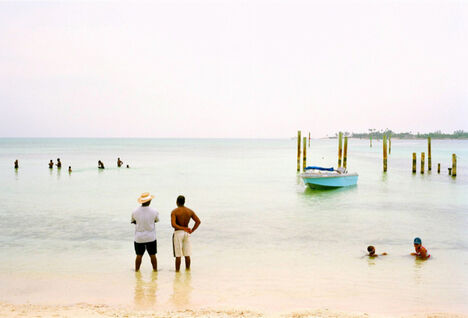 Two men looking out to sea in the Bahamas