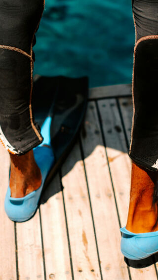 Diver standing on pontoon