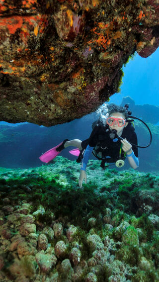 Young girl scuba diving