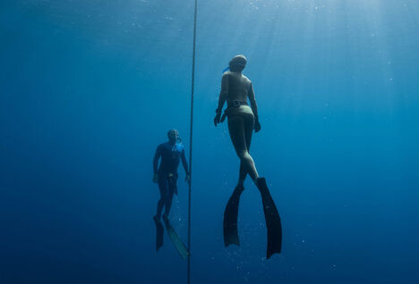 Two free divers underwater