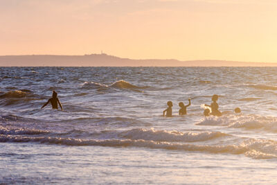 Children playing in the ocean